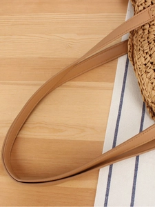 Handmade round straw shoulder bag with PU leather strap for seaside beach vacations
