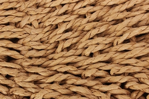 Macro view of woven paper rope texture showing intricate natural fiber braiding detail