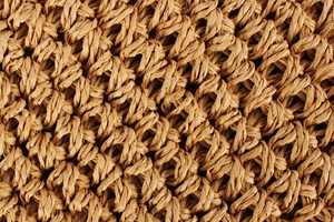 Macro shot of high-quality hand-woven paper rope material for bohemian beach bags