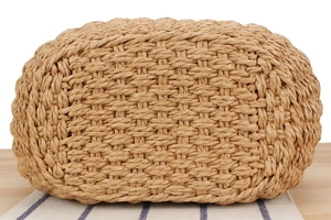 Close-up of natural paper rope woven texture on a casual beach vacation tote bag