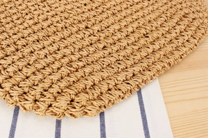 Macro shot of the natural woven paper straw texture and tight craftsmanship on the beach bag
