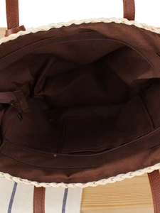 Top view of woven tote bag with brown lining, zipper closure and internal pocket
