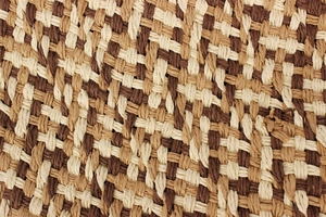 Macro view of high-density paper straw weaving texture in beige and brown tones