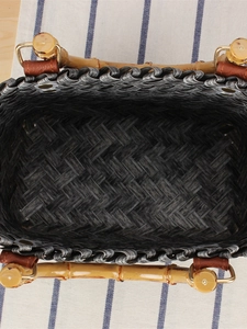 Vintage woven handbag with bamboo handles and dark grey textured finish from top view