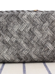 Vintage style woven handbag with bamboo handles and elegant black white mixed knit texture