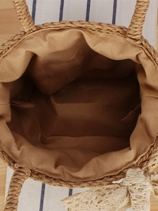 Handmade woven paper rope beach bag with spacious interior and natural cotton lining