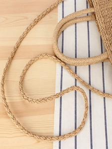 Minimalist woven beach tote bag with premium texture and durable shoulder strap