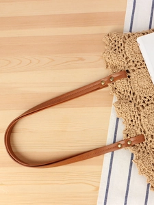 Large woven tote bag with brown leather shoulder strap for casual daily or beach vacation