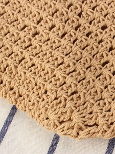 Large khaki woven tote bag with intricate hollow wave patterns for summer beach commuting