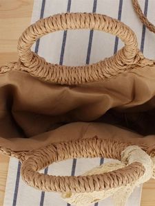 Minimalist semi-circular woven straw handbag for beach holidays with round handles