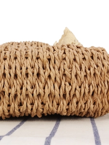 Minimalist woven semi-circle handbag in natural beige fiber with detailed crochet texture