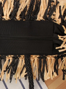 Ethnic woven beach tote bag with black and yellow fringes and top zipper closure
