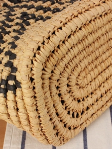 Ethnic woven beach tote bag with straw texture and contrast black stripes detail