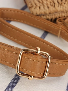 Brown leather crossbody bag strap with gold buckle and textured paper rope weaving detail