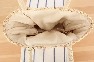Detail of corn husk woven bag showing canvas lining and drawstring closure