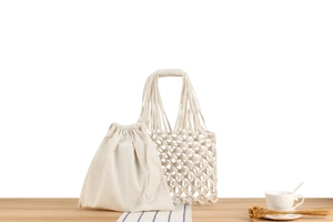 Detailed view of handmade woven cotton rope handbag with drawstring linen inner pouch