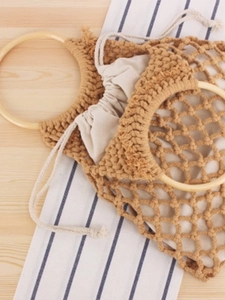 Bohemian mustard yellow woven tote bag with wooden handles and drawstring inner pouch