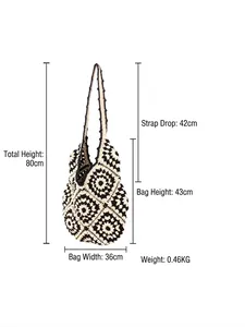 Handmade crochet tote bag with black and white floral pattern and size measurements