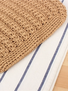 Light brown crochet woven shoulder bag featuring intricate shell pattern cotton texture