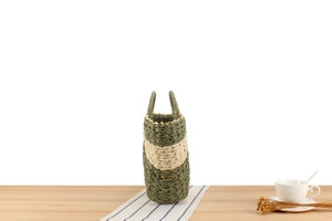 Detail of eco-friendly paper rope weave texture on a two-tone woven summer beach handbag
