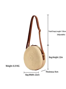Handwoven round straw bag with adjustable brown leather strap and dimensions display