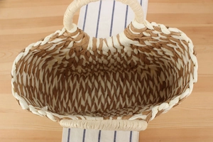 Top-down view showing spacious interior and diamond texture of this woven straw bag