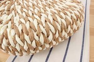 Detailed macro view of dual-tone paper rope weaving texture on a semi-circle beach bag
