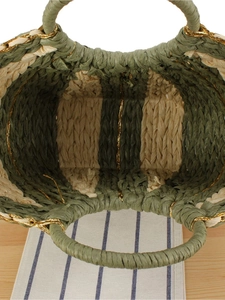 Handmade woven straw beach bag with green stripes and gold accents on round handles