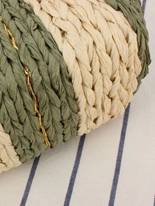 Minimalist straw woven handbag with green stripes and golden metallic thread accents