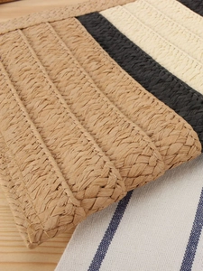 Handwoven paper straw crossbody bag with striped color-block pattern and zip closure