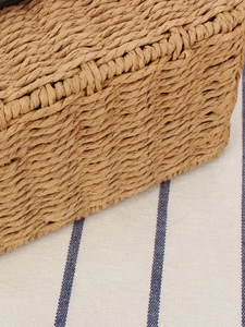 Minimalist paper rope woven square bag in brown showing handmade straw texture