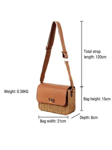 Minimalist woven straw crossbody bag with brown leather flap and dimensions 21x15x8cm