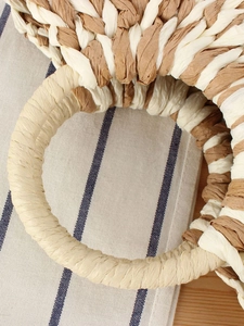 Handcrafted semicircular paper rope woven handbag with round handles for beach vacations