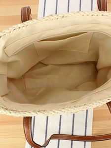 Hollow straw shoulder bag with beige paper rope weaving and brown leather handles