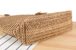 Macro shot of natural woven texture and durable base on a summer straw tote bag