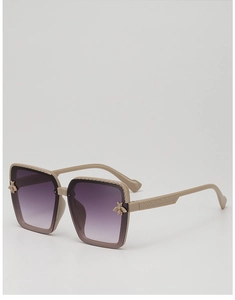 Close-up of beige square frames with bee emblem and purple gradient lenses