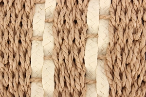 Close-up of dual-tone woven texture in dark brown and beige natural fiber material