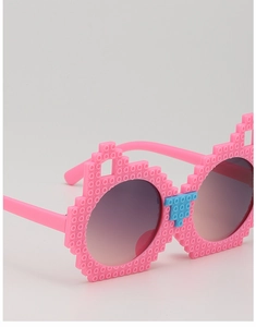 Detail of pink pixelated building block sunglasses for kids with blue nose bridge accents