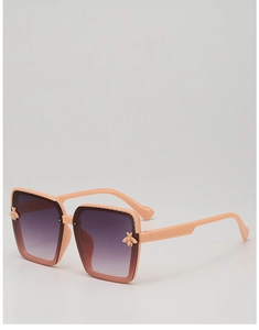 Detailed view of kids' orange square sunglasses with bee accents and textured temples