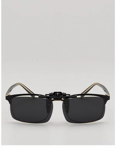 Detail view of detachable polarized sunglasses clip-on with golden metal temple accents