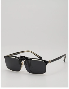 Detail of polarized clip-on sunglasses with black square lenses and gold metal trim