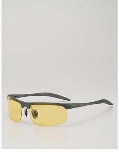 Detail of yellow night vision lenses and matte grey semi-rimless sports frame sunglasses