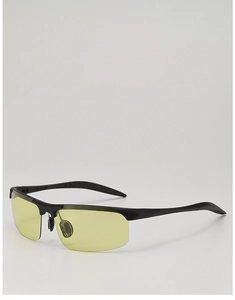 Close-up of semi-rimless sunglasses with yellow night vision lenses and black frame