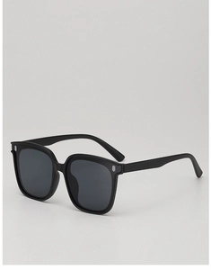 Detail of black oversized square sunglasses frame with metallic three-bar accents