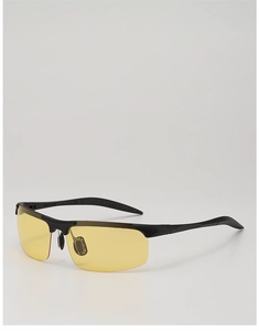 Detail of yellow night vision lenses with black semi-rimless frame and non-slip temples