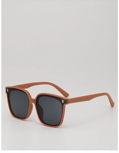 Detailed side view of caramel brown square frame sunglasses with silver temple accents