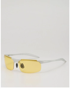 Detail of white semi-rimless sports sunglasses with yellow night vision lenses and grip pads