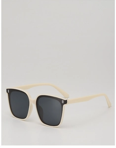 Detailed shot of beige square frame children's sunglasses with black lenses and logo