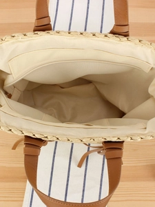 Handcrafted woven straw tote bag with brown PU handles and secure zipped interior