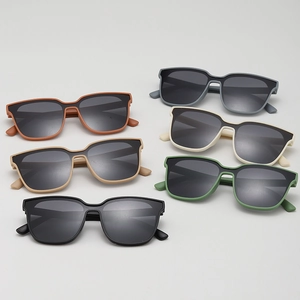 Flat lay of square oversized kids sunglasses in six matte colors with grey lenses